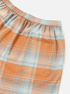 Close-up of the Orange Check Pyjama Short. Features a blue, orange, and white plaid pattern, elastic waistband, and back pocket. Shot on a white background.