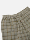 Close-up of the Green PJ Plaid Pyjama Short. The shorts feature a green and brown plaid pattern and an elastic waistband. Shot against a white background.