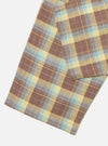 Close-up of the Yellow/Brown Check Pyjama Pant on a white surface. The fabric features a brown, yellow, and blue plaid pattern.