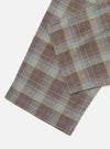 Close-up of the Green/Brown Check Pyjama Pant on a white surface. The fabric features a classic plaid pattern with green, brown, and light blue hues.