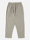 The Green Tiny Check Pyjama Pant on a white background. The pants have a relaxed fit and an elastic waistband. The fabric is a tiny green and white check pattern.