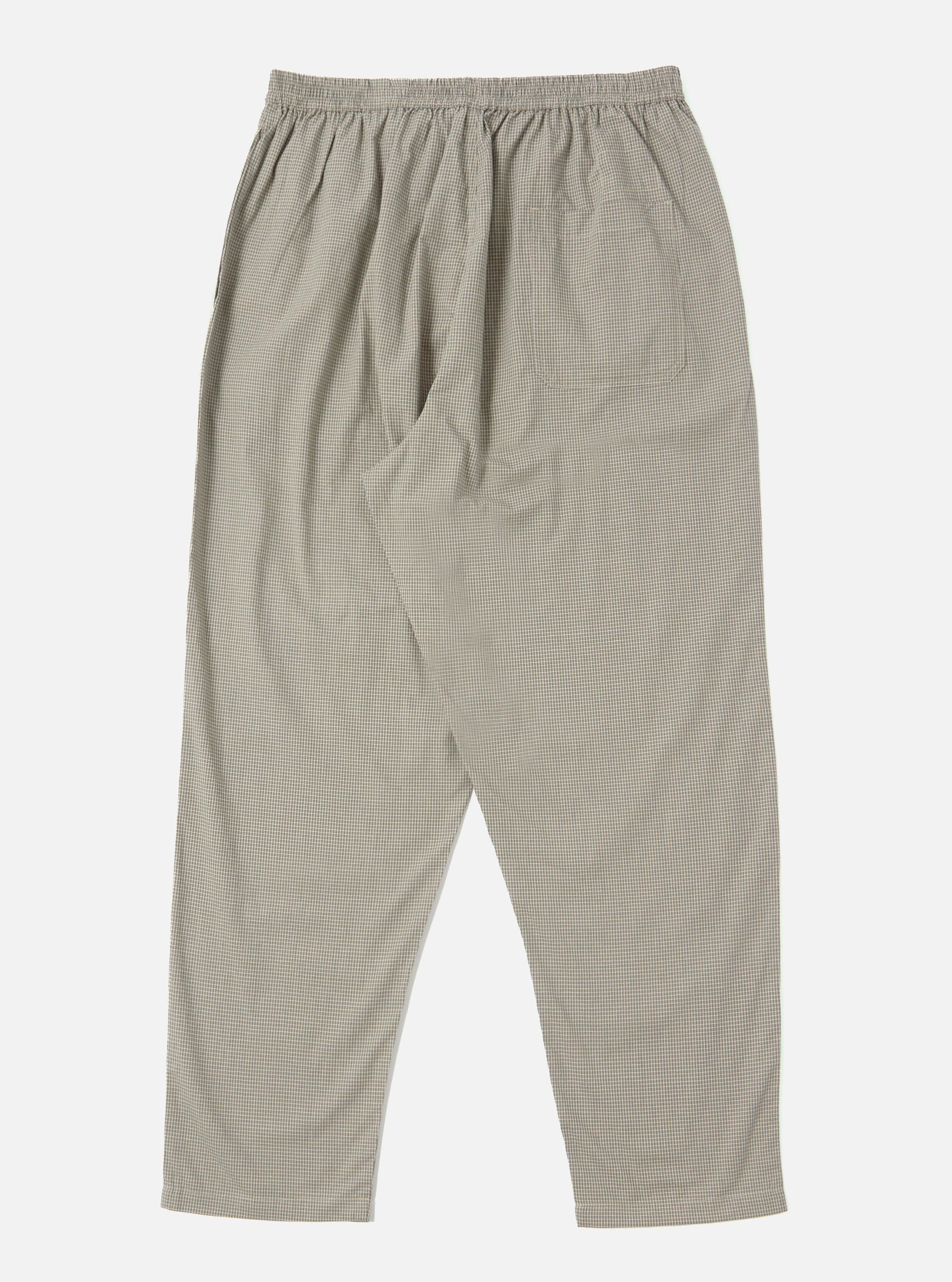 The Green Tiny Check Pyjama Pant on a white background. The pants have a relaxed fit and an elastic waistband. The fabric is a tiny green and white check pattern.