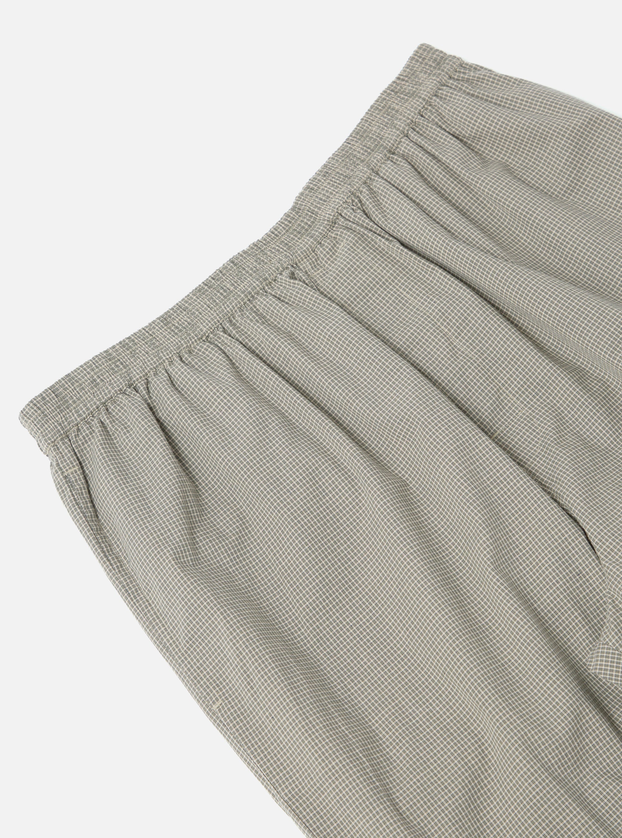 Close-up of the Green Tiny Check Pyjama Pant, showcasing its elastic waistband and soft, checkered fabric on a clean, white background.