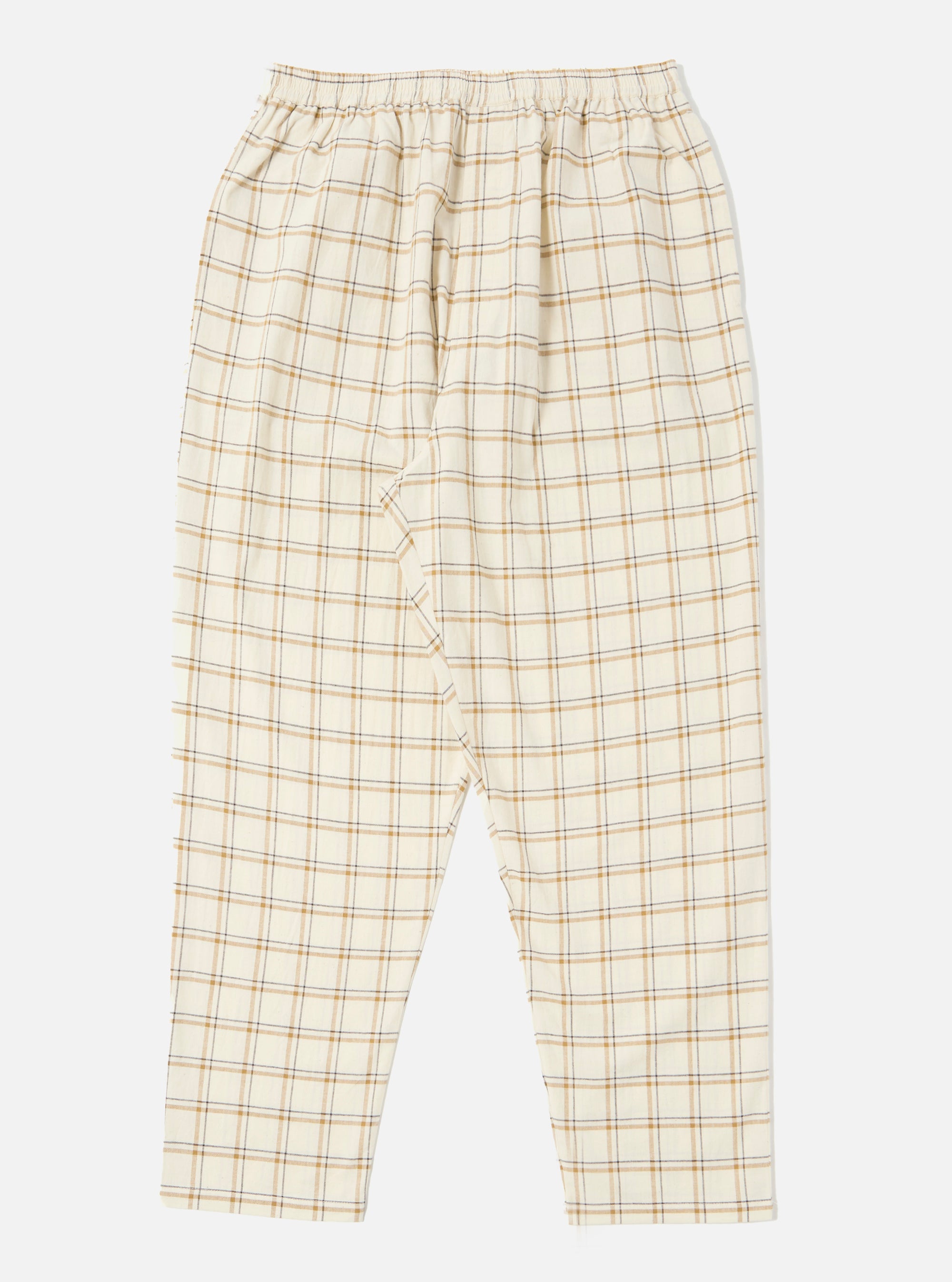 Close-up of the Ecru PJ Plaid Pyjama Pant on a white background. The pants are ecru with a brown and grey plaid pattern and an elastic waistband.