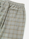 Close-up of the Green PJ Plaid Pyjama Pant on a white background. The fabric is a soft, brushed cotton with a green, gold, and brown plaid pattern. Features an elastic waistband and a pocket.