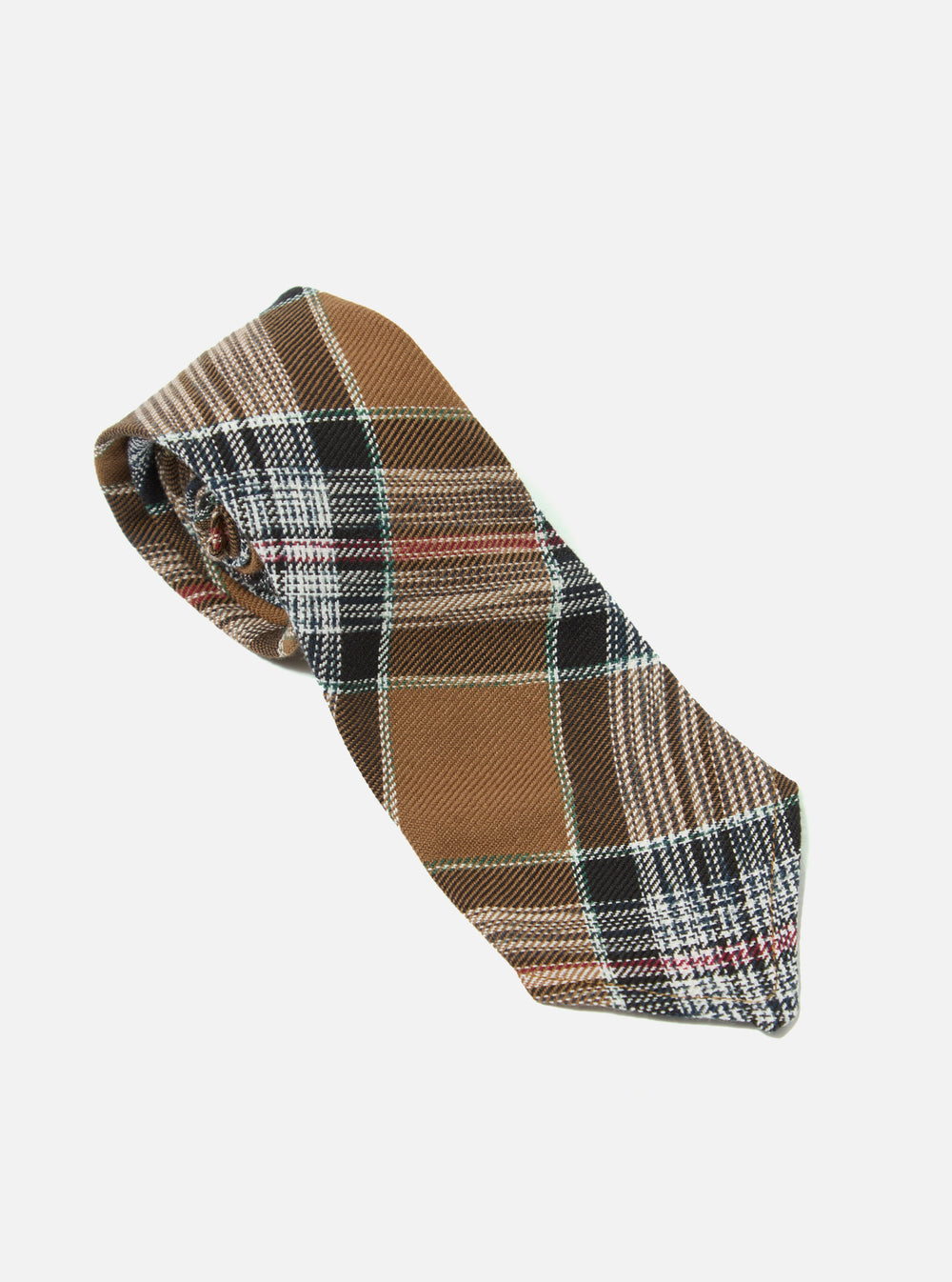 The Brown Ikat Twill Check Tie is displayed on a white background. The tie features a brown, black, and white check pattern.