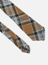 Close-up of a Brown Ikat Twill Check Tie on a white background. The tie features a brown, black, and white check pattern with subtle red and green accents.
