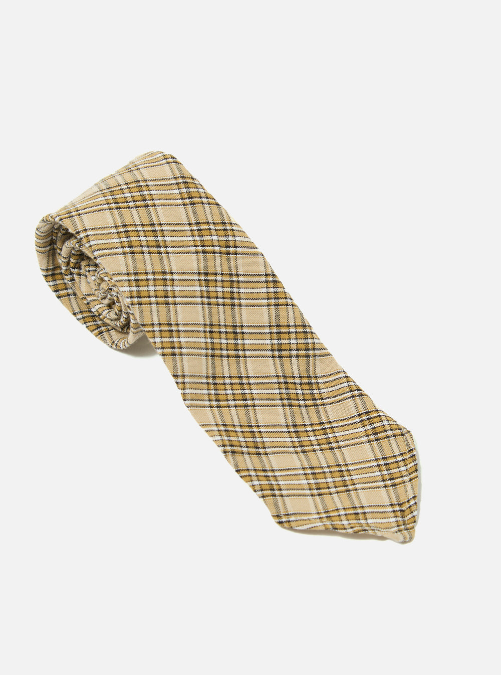 The Sand Picnic Plaid Tie, featuring a tan, brown, and white plaid pattern, is coiled on a clean white background.