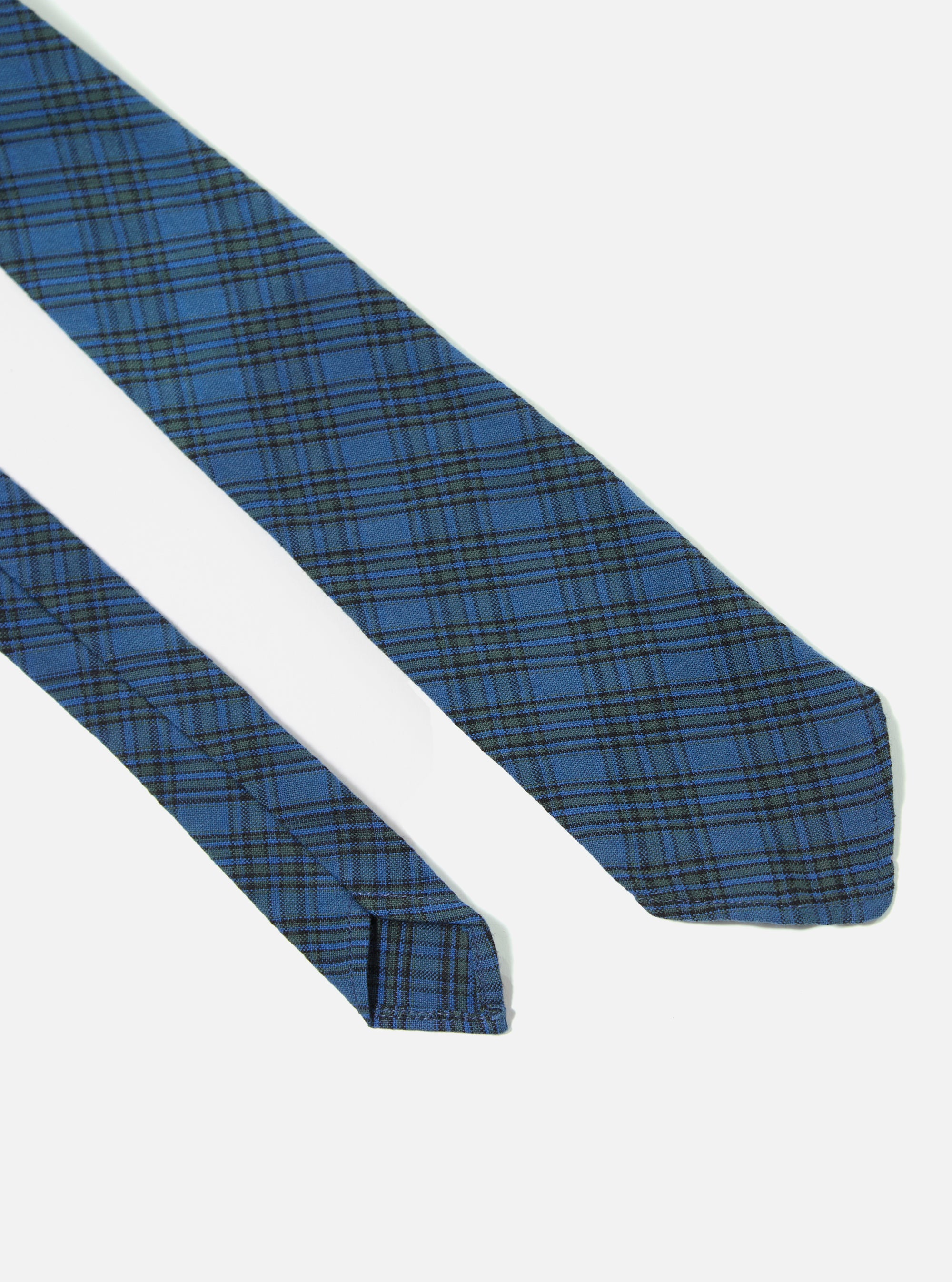 Close-up of the Navy Picnic Plaid Tie on a white background. The tie features a blue and black plaid pattern.