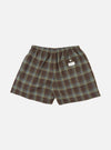 The Green Patchwork Madras Boxer Short laid flat on a white background. The shorts are green and brown plaid with an elastic waistband.
