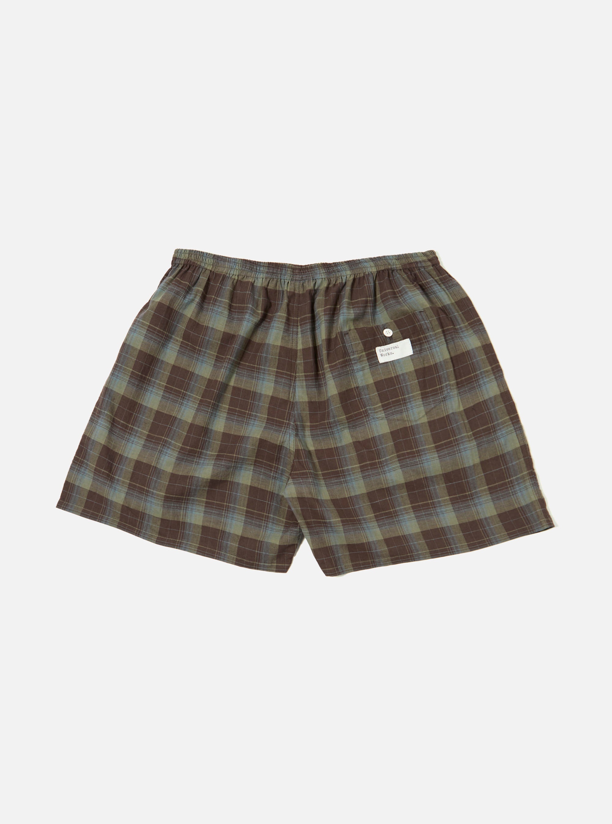 The Green Patchwork Madras Boxer Short laid flat on a white background. The shorts are green and brown plaid with an elastic waistband.
