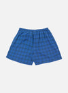 The Navy PJ Plaid Boxer Short on a white background. The boxer short is blue with a green and black plaid pattern and has an elastic waistband.