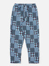 The Blue Brushed Patchwork Pyjama Pant on a white background. These cotton pants feature a blue, white, and red patchwork design and a relaxed fit.