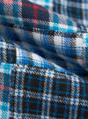 Close-up of the Blue Brushed Patchwork Pyjama Pant. Soft, brushed fabric with a blue, white, and black plaid pattern. Cozy and comfortable sleepwear.