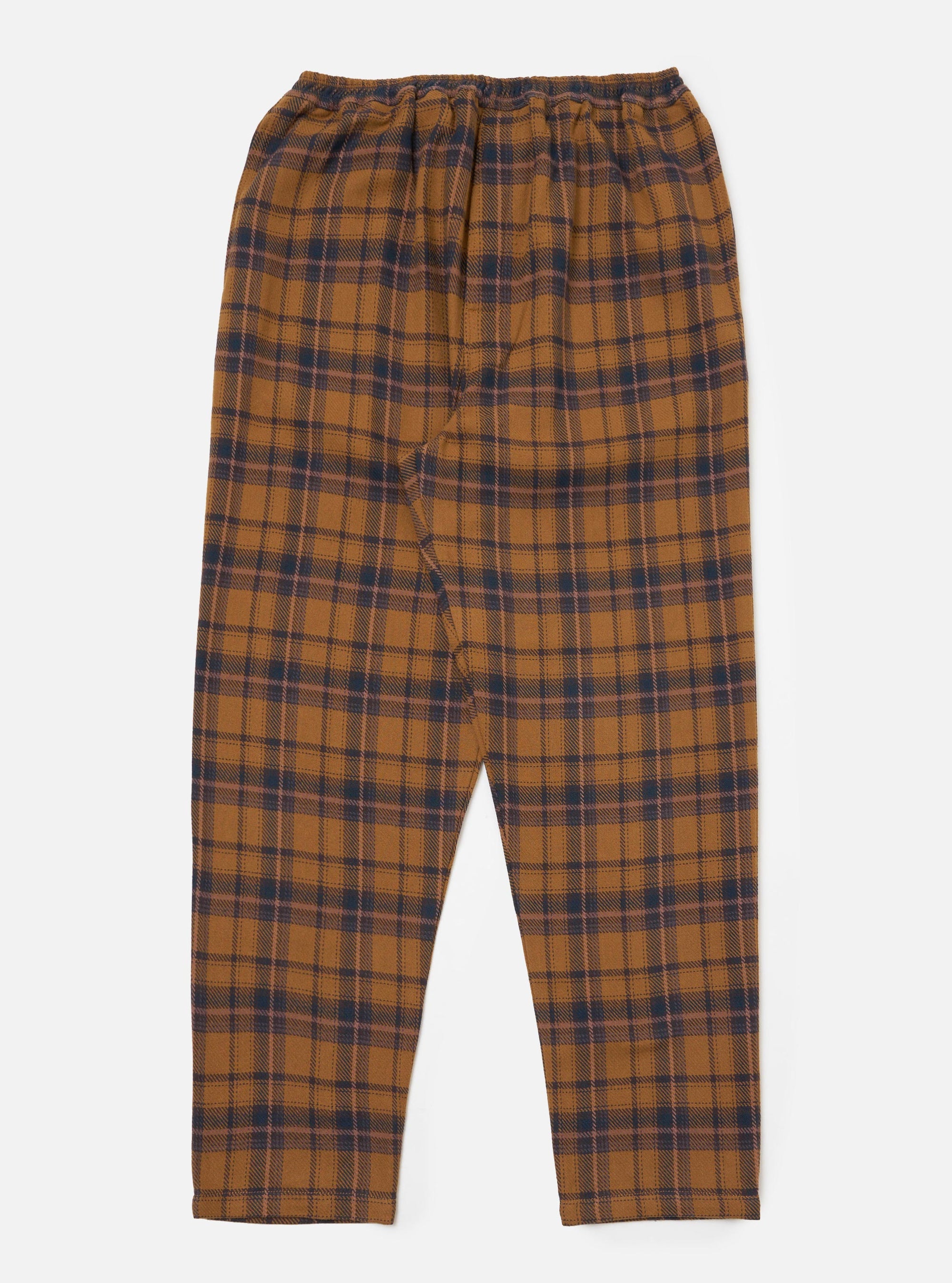 Flat lay of Caramel Twill Check Pyjama Pant on a white background. The pyjama pants are caramel with a navy and pink check pattern and have an elasticated waist.