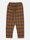 The Caramel Twill Check Pyjama Pant. Caramel and navy twill check pattern. Elasticated waist. Flat lay on a white background.