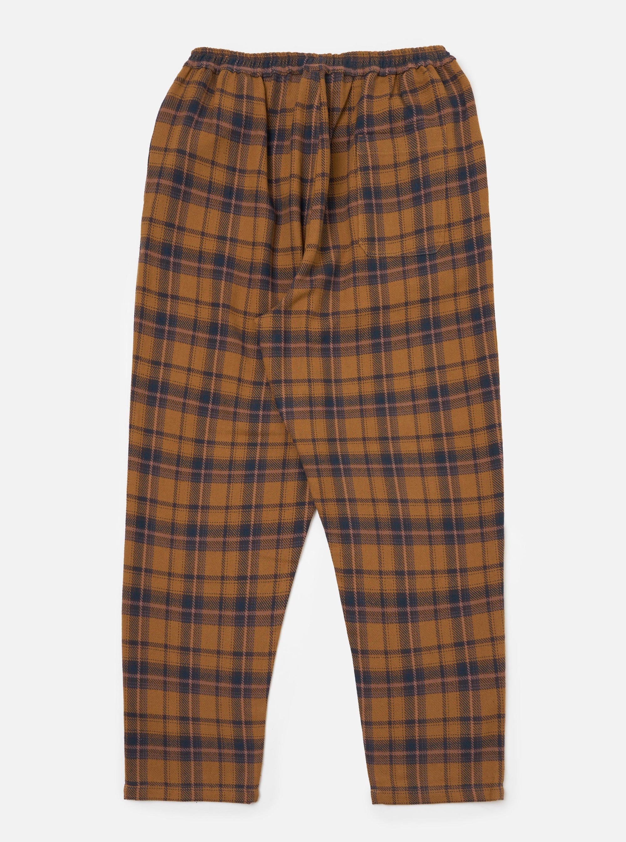 The Caramel Twill Check Pyjama Pant. Caramel and navy twill check pattern. Elasticated waist. Flat lay on a white background.