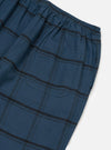 Close-up of the Blue Brushed Check Pyjama Pant on a white surface. The brushed cotton fabric features a blue and black check pattern. Elasticated waist and back pocket are visible.