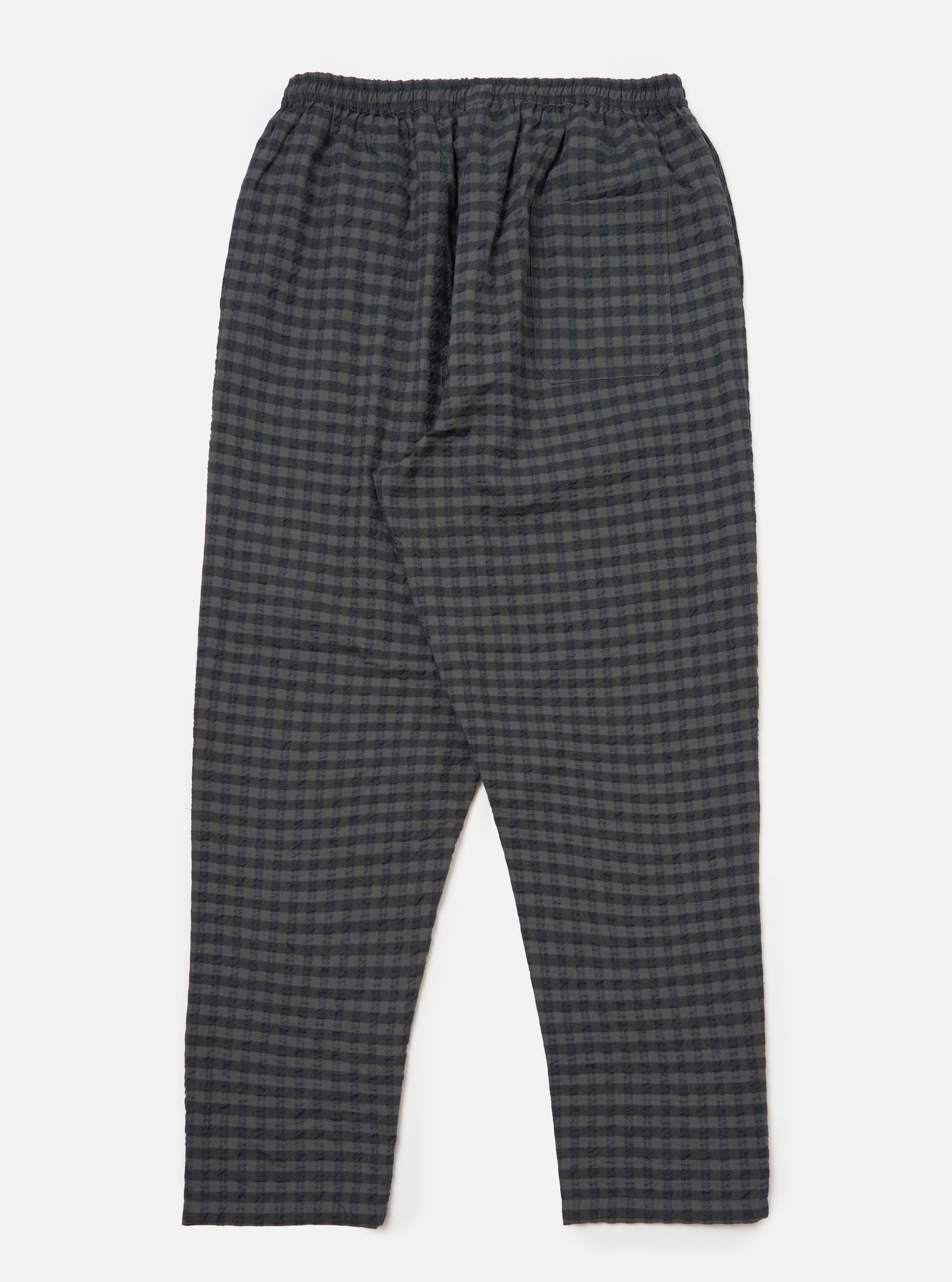 Close-up of the Charcoal/Navy Seersucker Plaid Pyjama Pant on a white background. The plaid pattern is visible, showcasing the seersucker texture and the pant's relaxed fit.