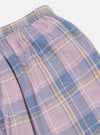 Close-up of the Pink/Blue Pastel Plaid Pyjama Pant, showcasing the elastic waistband and pocket detail. The fabric is soft and cozy, perfect for lounging. Shot on a clean, white background.