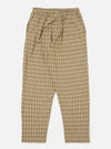 The Sand Picnic Plaid Pyjama Pant, displayed on a white background. The pants are a loose fit, made of a beige and brown plaid fabric. The pants have an elastic waistband.