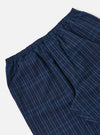 Close-up of the Indigo Plaid Long Pyjama Set. The fabric is a blue plaid pattern. The background is a plain white.