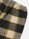 Close up of the Black/Sand Brushed Big Check Long Pyjama Set. Features a black, sand, and grey brushed check pattern with yellow stripes. Elastic waist. On a white background.