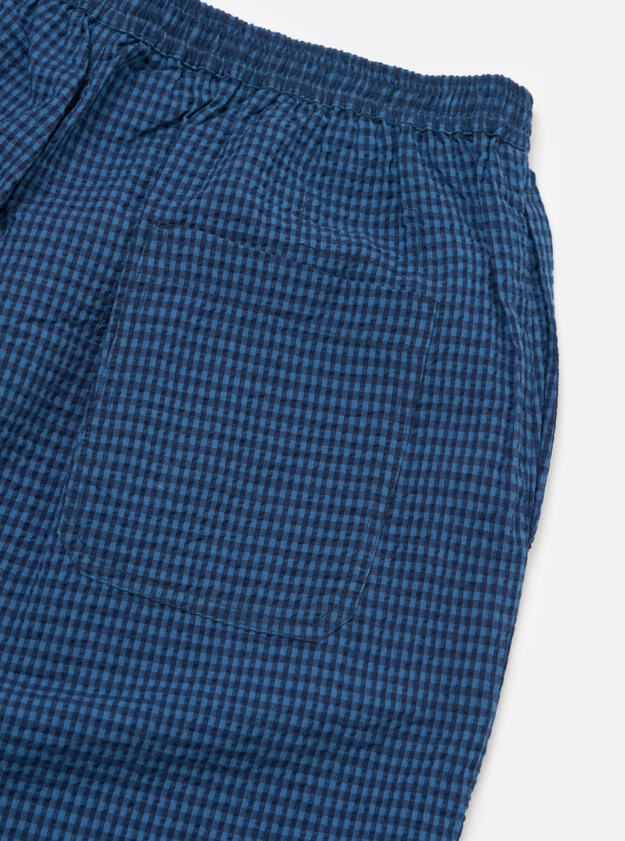 Close-up of the Blue Gingham Seersucker Pyjama Short on a white background. Shows the elasticated waist and back pocket detail.