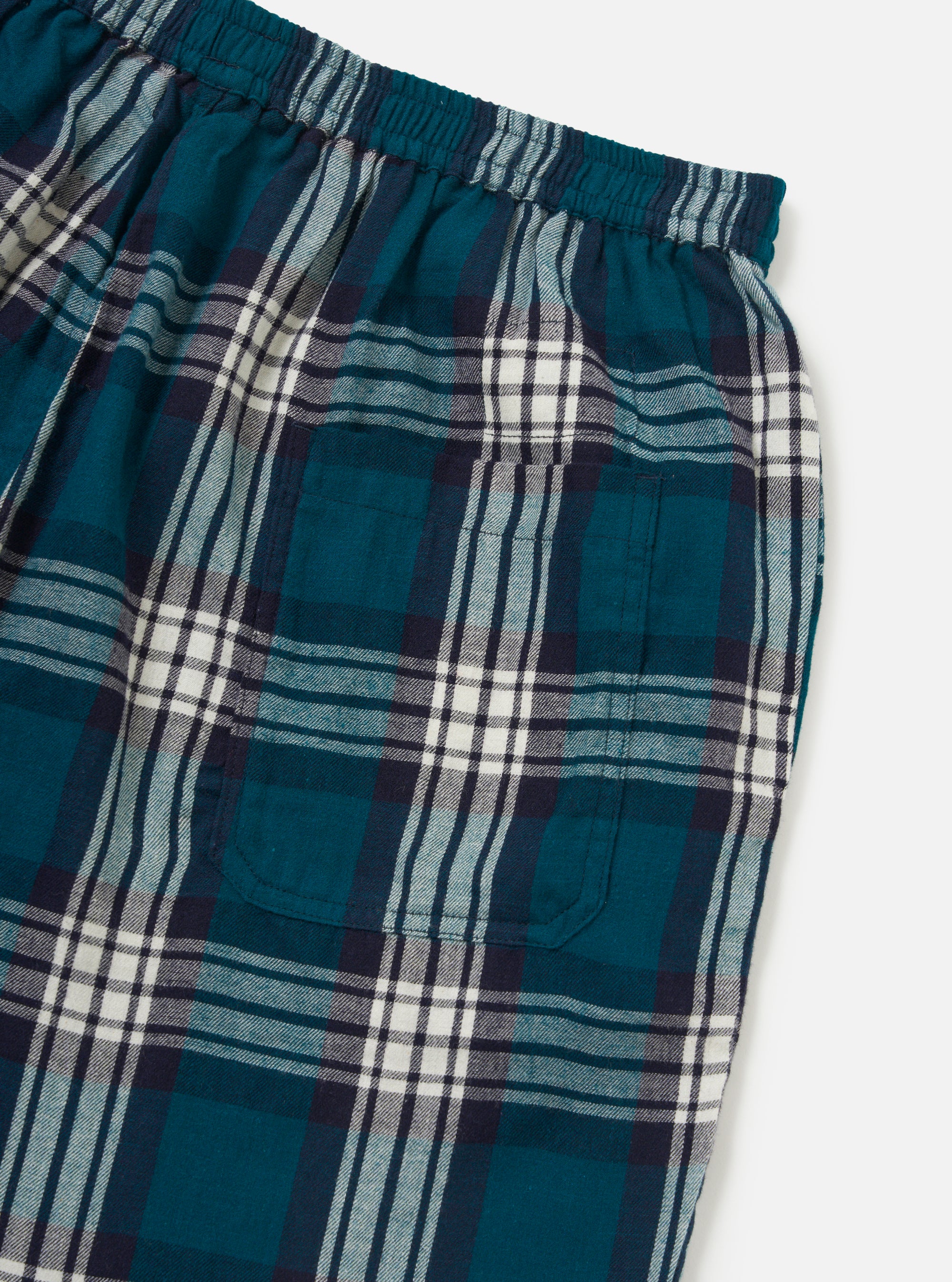 Close-up of the Forest Brushed Plaid Pyjama Short, showcasing the green, navy, and white plaid pattern. The elastic waistband and pocket detail are visible against a clean white background.