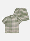 The Green Busy Plaid Short Pyjama Set, featuring a button-down shirt and elastic-waist shorts in a green, beige, and black plaid pattern, staged on a white background.