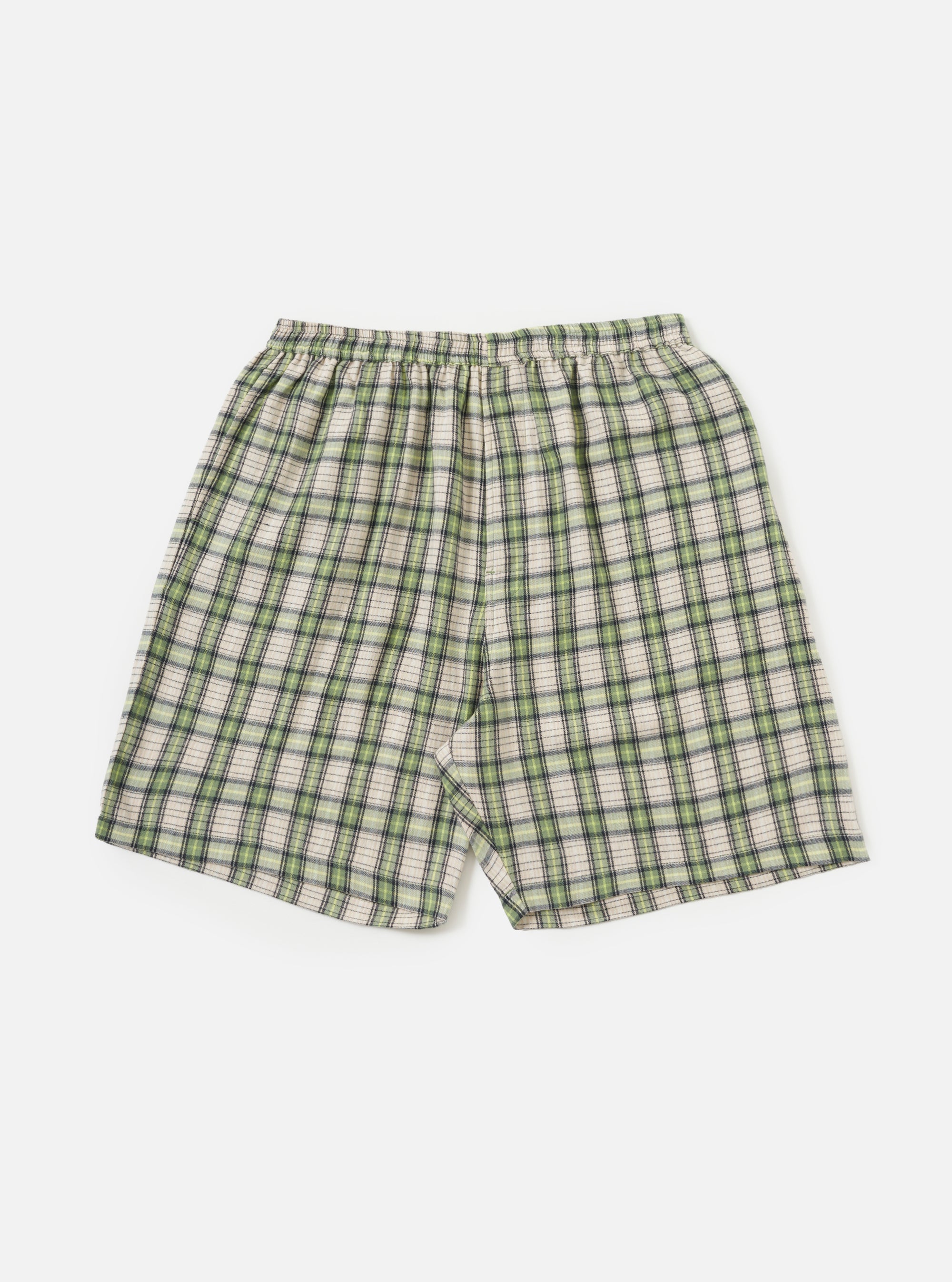 The Green Busy Plaid Short Pyjama Set on a white background. The shorts are green, black, and white plaid with an elastic waistband.