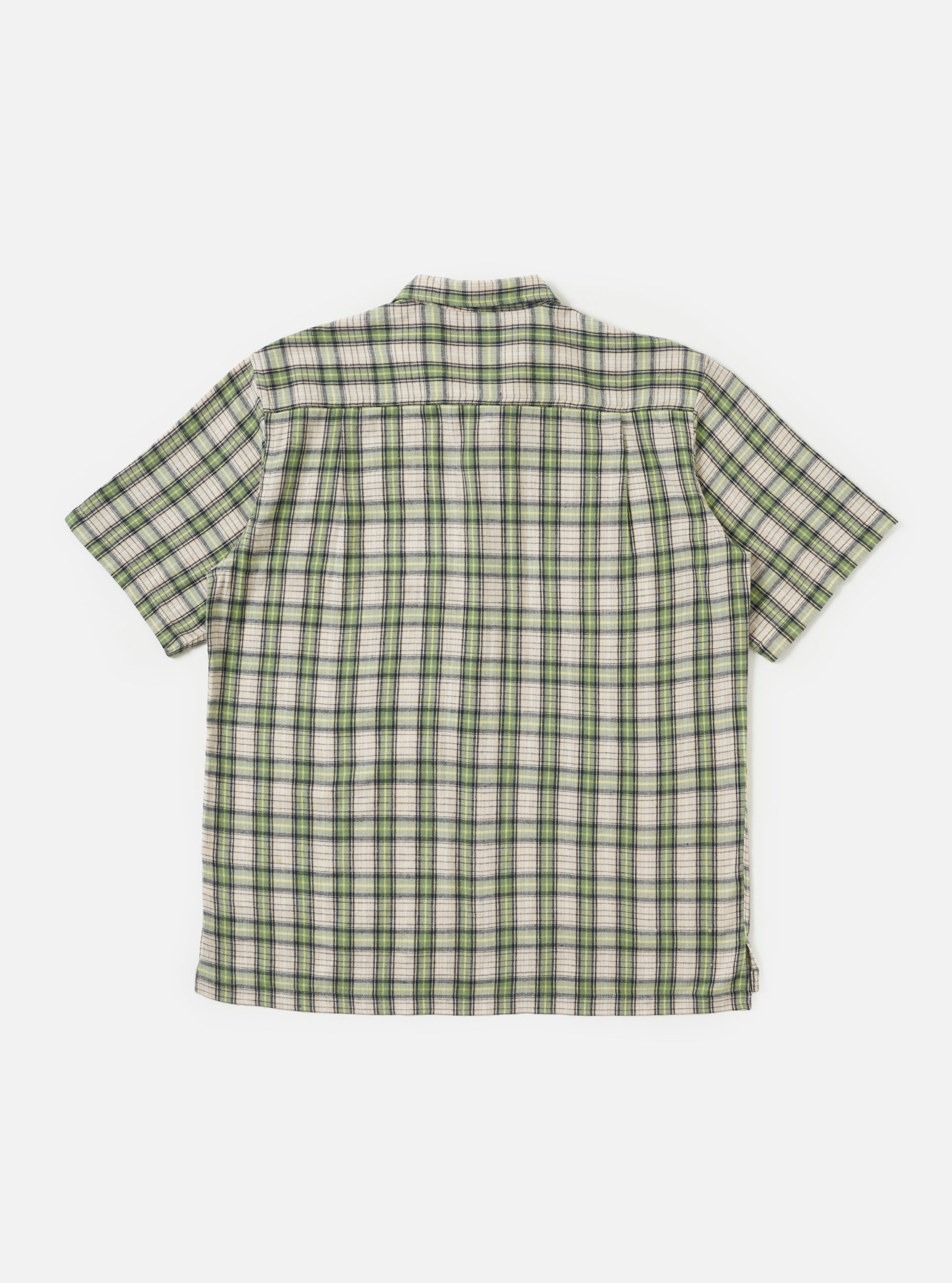 Back view of the Green Busy Plaid Short Pyjama Set top, laid flat on a white background. The shirt is a green, white, and black plaid.