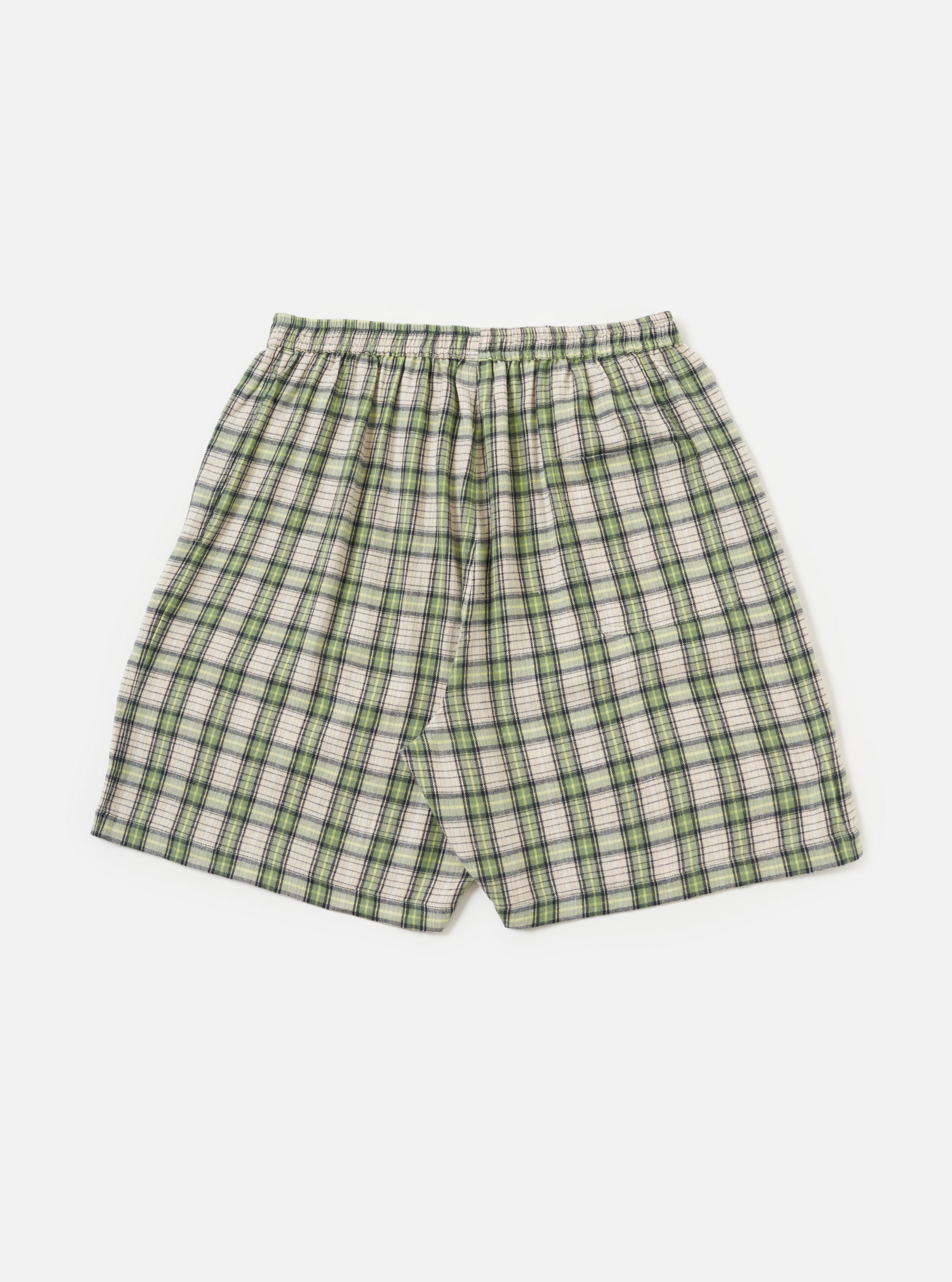 The Green Busy Plaid Short Pyjama Set on a white background. The shorts are green, white, and black plaid with an elastic waistband.