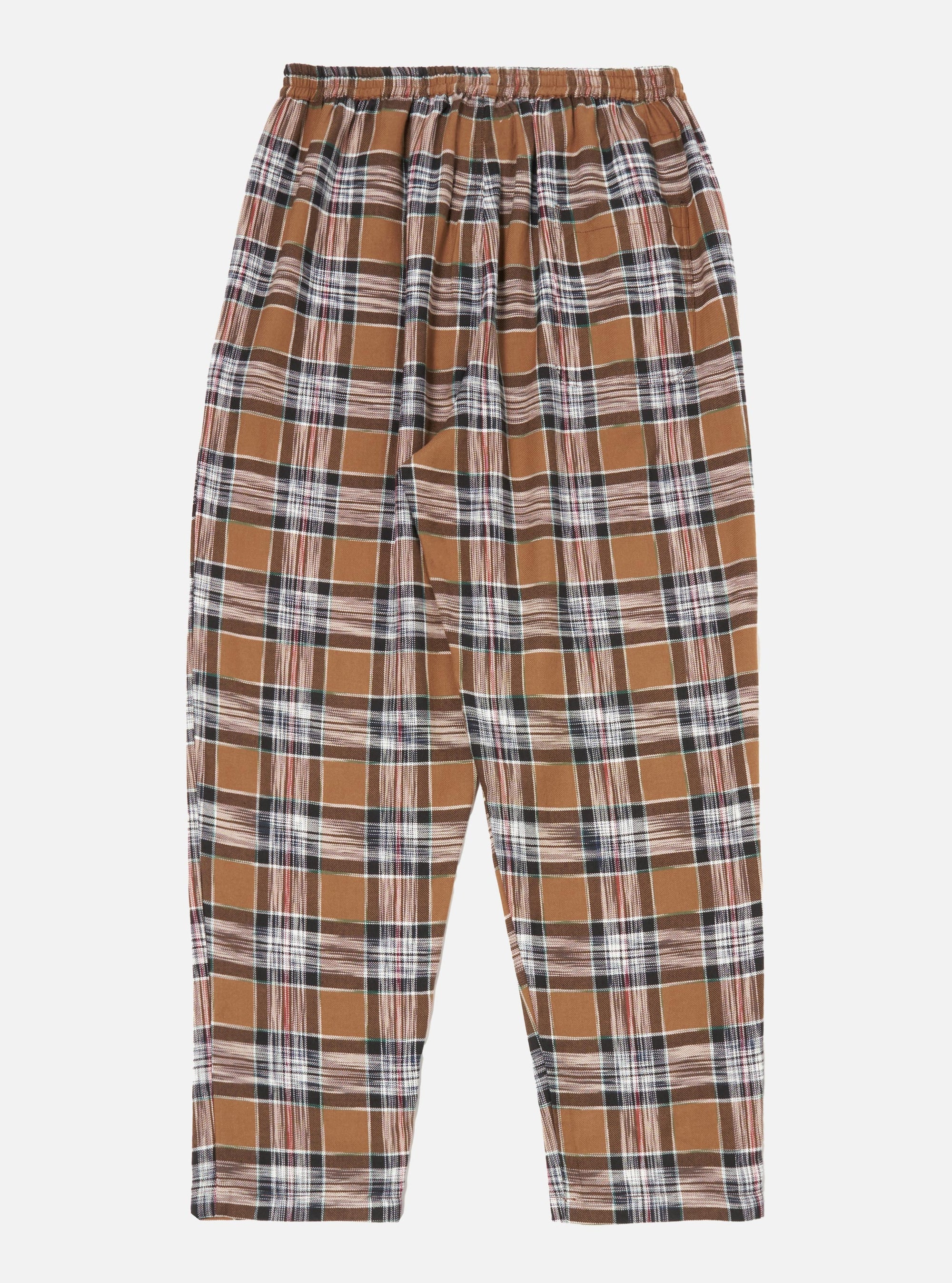 Close-up of the Brown Ikat Twill Check Long Pyjama Set pants on a white background. The brown, black, and white plaid twill fabric has a relaxed fit.