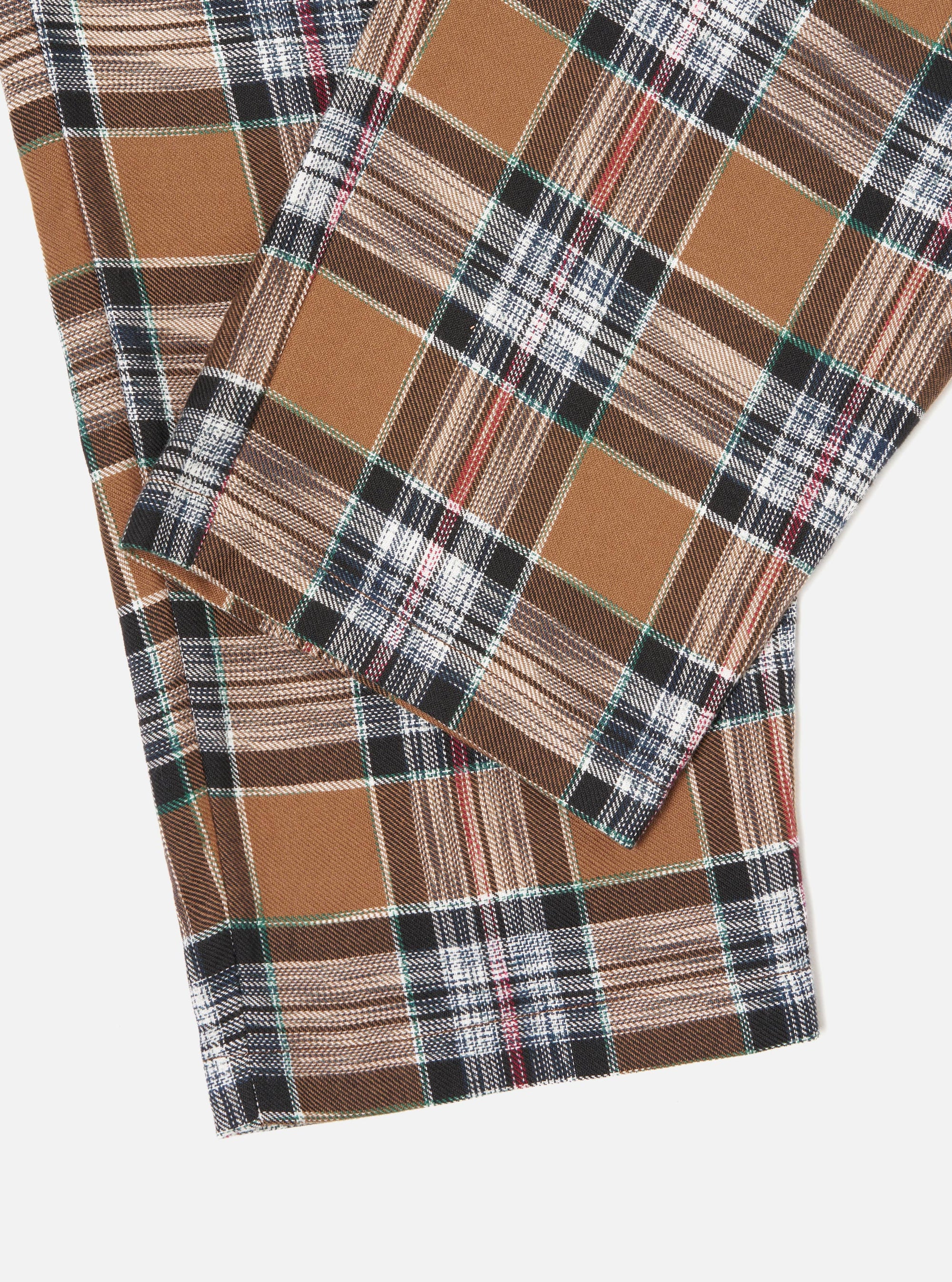 Close-up of the Brown Ikat Twill Check Long Pyjama Set. The fabric is a brown plaid with black, white, and blue accents. Shot on a white background.