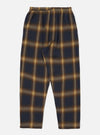 The Navy Canyon Check Pyjama Pant on a white background. The pants have a navy and tan check pattern and an elastic waist. The fit is relaxed.