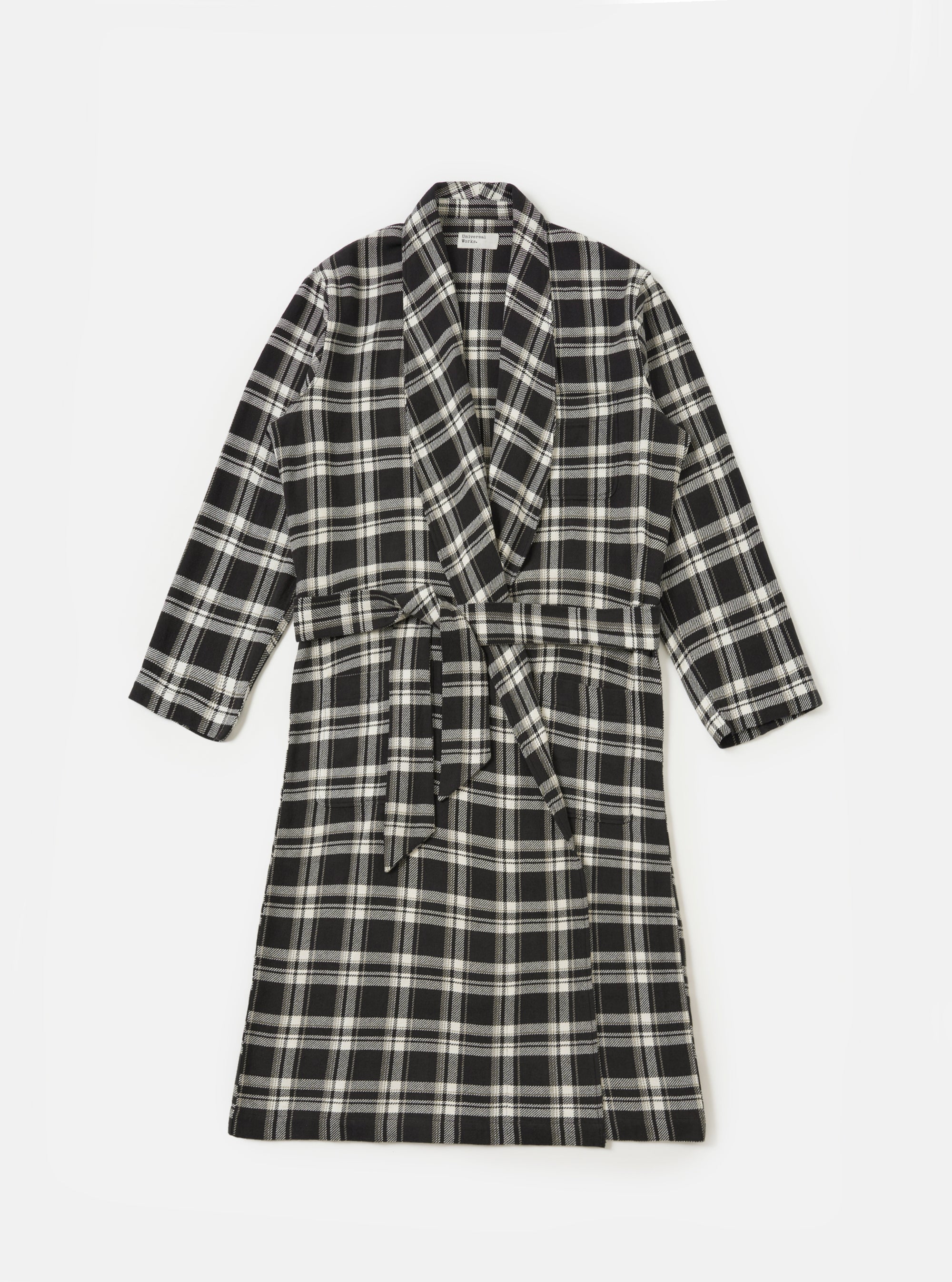The Black Twill Check Long Dressing Gown is laid flat on a white background. The gown is black and white check with a tie waist.