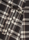 Close-up of the Black Twill Check Long Dressing Gown fabric. Features a black, white, and tan twill check pattern. Soft, cozy material.