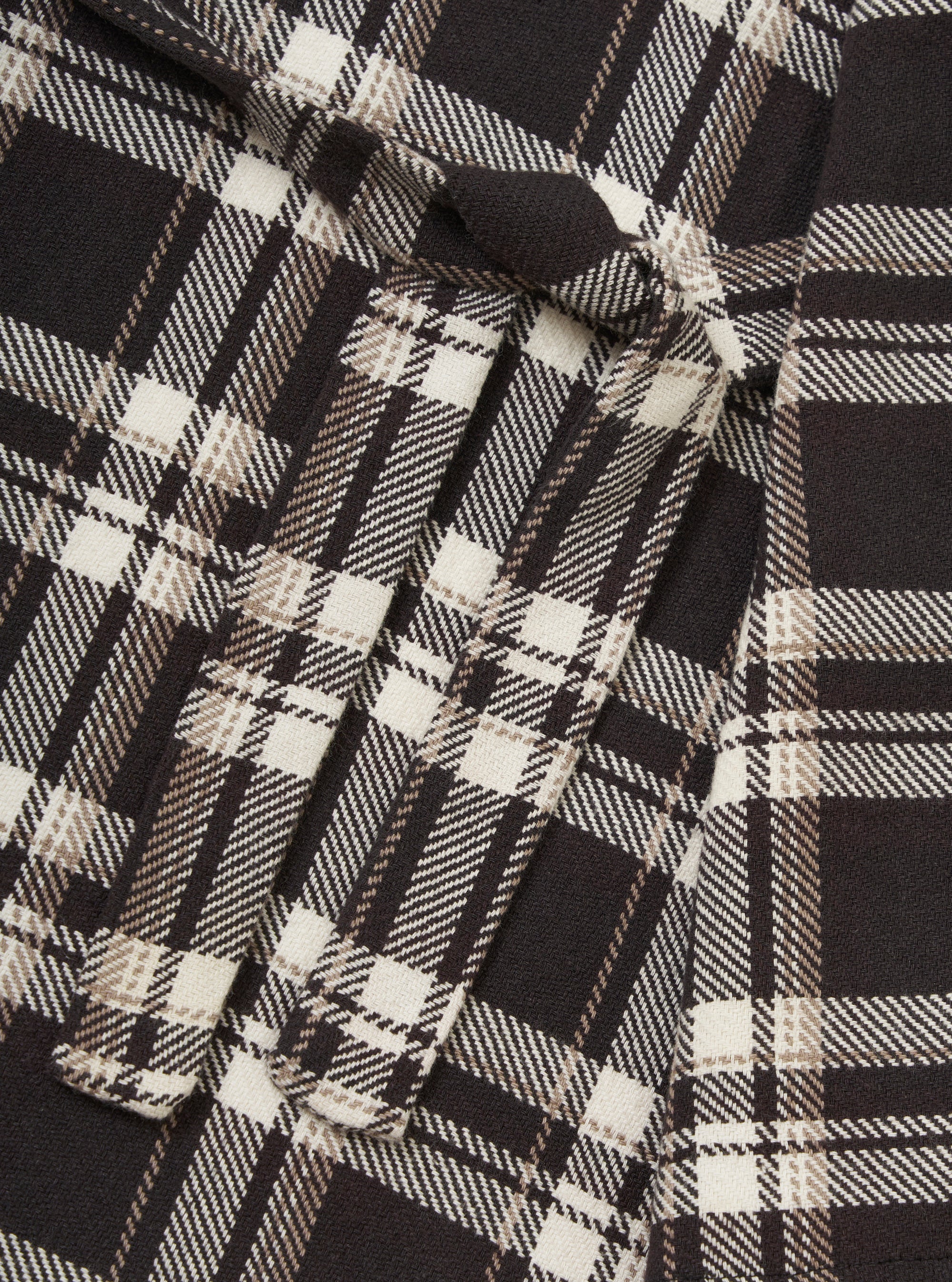 Close-up of the Black Twill Check Long Dressing Gown fabric. Features a black, white, and tan twill check pattern. Soft, cozy material.