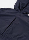 The Navy Seo Recycled Nylon Boston Parka is shown in a detail view as a flat lay against a plain white background. The image highlights the technical, smooth texture of the navy blue recycled nylon fabric and focuses on functional construction details such as the hood or a pocket.