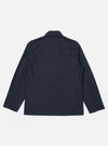 The Navy Recycled Polytech Bakers Jacket is shown from the back as a flat lay against a plain white background. The image highlights the clean construction, simple collar, and straight hem of the jacket.