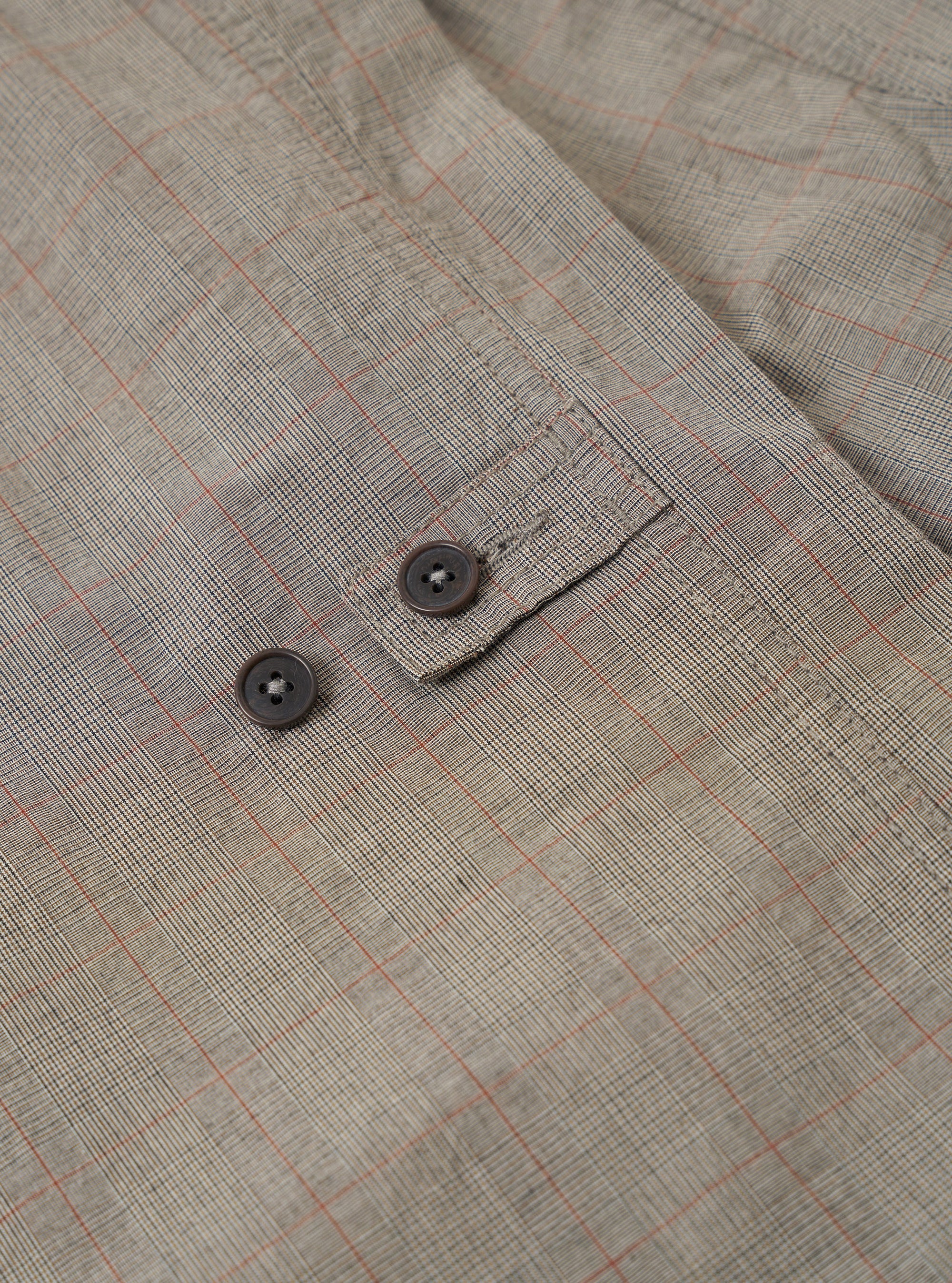 The Grey Brown Wales Glen Check Barra Jacket is shown from the back as a flat lay against a plain white background. The image highlights the center back vent and the clean lines of the jacket's rear construction. The grey and brown glen check pattern is visible across the entire garment.