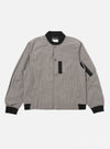 The Grey Brown Wales Glen Check NS Bomber Jacket is shown as a flat lay against a plain white background. The jacket features a prominent glen check pattern in shades of grey and brown, a full zip front, and a classic ribbed collar, cuffs, and hem. Two slanted welt pockets are visible on the front.