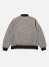 The Grey Brown Wales Glen Check NS Bomber Jacket is shown from the back as a flat lay against a white background. The jacket features a prominent glen check pattern in shades of grey and brown, with a ribbed collar, ribbed hem, and set-in sleeves.