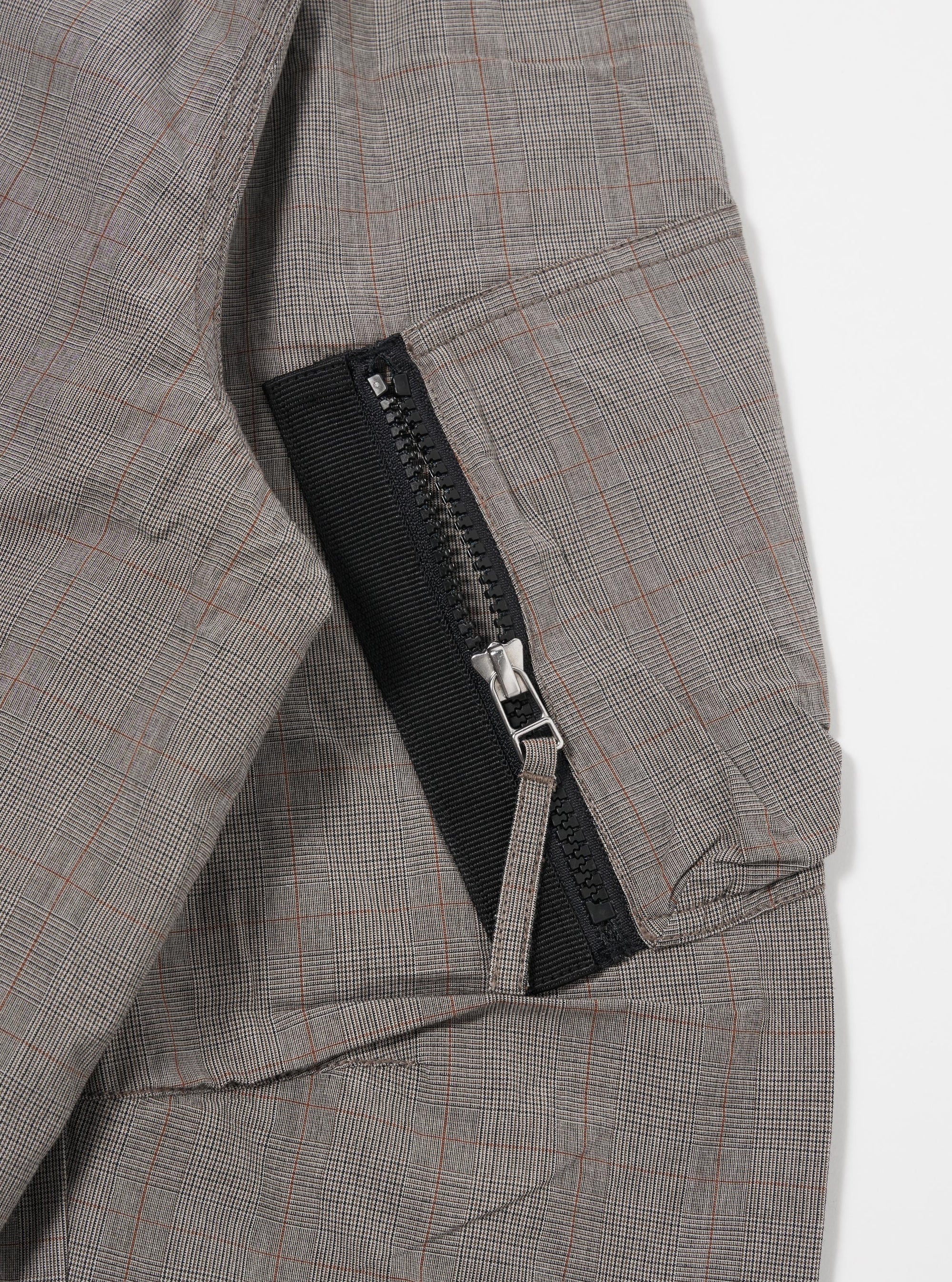 The Grey Brown Wales Glen Check NS Bomber Jacket is shown from the back as a flat lay against a white background. The jacket features a prominent glen check pattern in shades of grey and brown, with a ribbed collar, ribbed cuffs, and a ribbed hem.