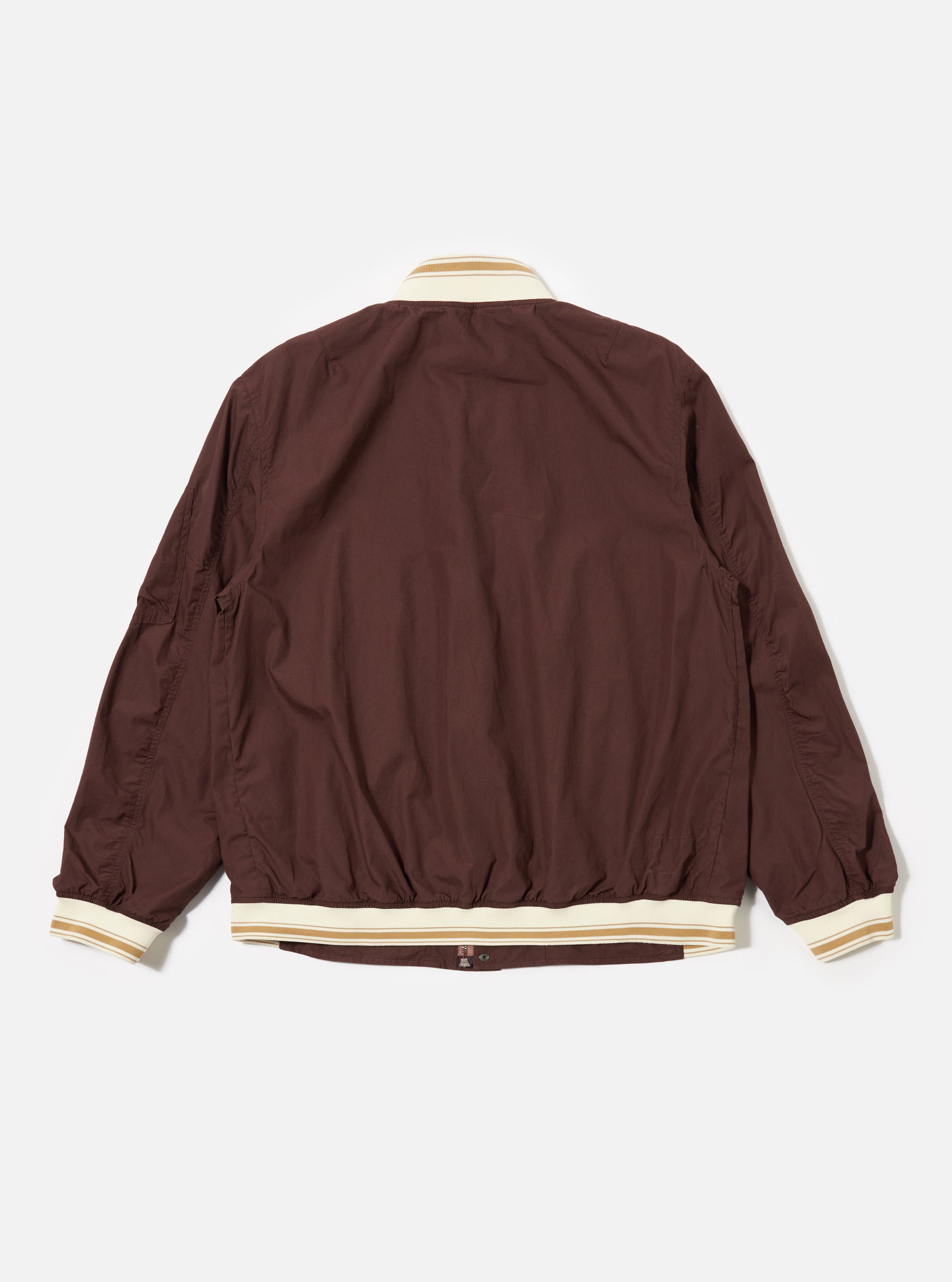 The Brown Peached Poplin NS Bomber Jacket is shown from the back as a flat lay against a plain white background. The image highlights the smooth, matte texture of the brown cotton poplin fabric and the simple construction of the garment's rear panel, including a visible ribbed collar and hem.