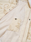 The Ecru 3D Flower NS Bomber Jacket is displayed from the back as a flat lay against a solid white background. The image showcases the detailed 3D floral texture of the ecru-colored cotton fabric across the rear panel. The jacket features a ribbed collar, long sleeves with ribbed cuffs, and a ribbed hem.