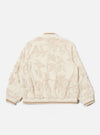 The Ecru 3D Flower NS Bomber Jacket is shown from the back as a flat lay against a plain white background. The jacket features an all-over textured 3D flower pattern on ecru fabric, accented by contrast stripe ribbing on the collar and hem. The image highlights the articulated sleeve construction and the clean, straight hem.