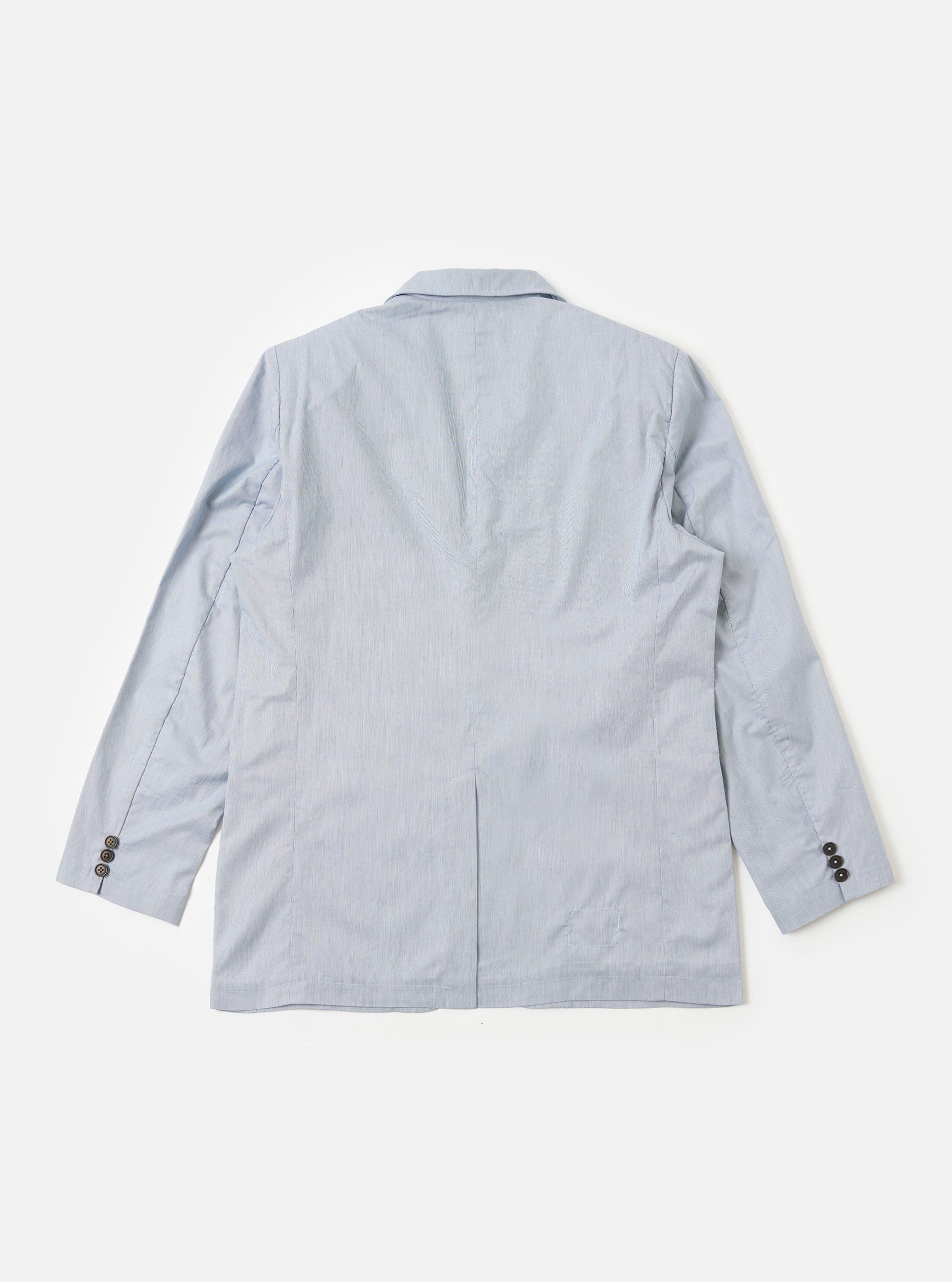 The Navy Kennedy Stripe Boston Blazer is shown from the back as a flat lay against a plain white background. The image highlights the clean lines of the blazer's rear construction, the vertical pinstripe pattern, and a single vent at the hem. The fabric is a navy blue cotton with thin, light-colored stripes.