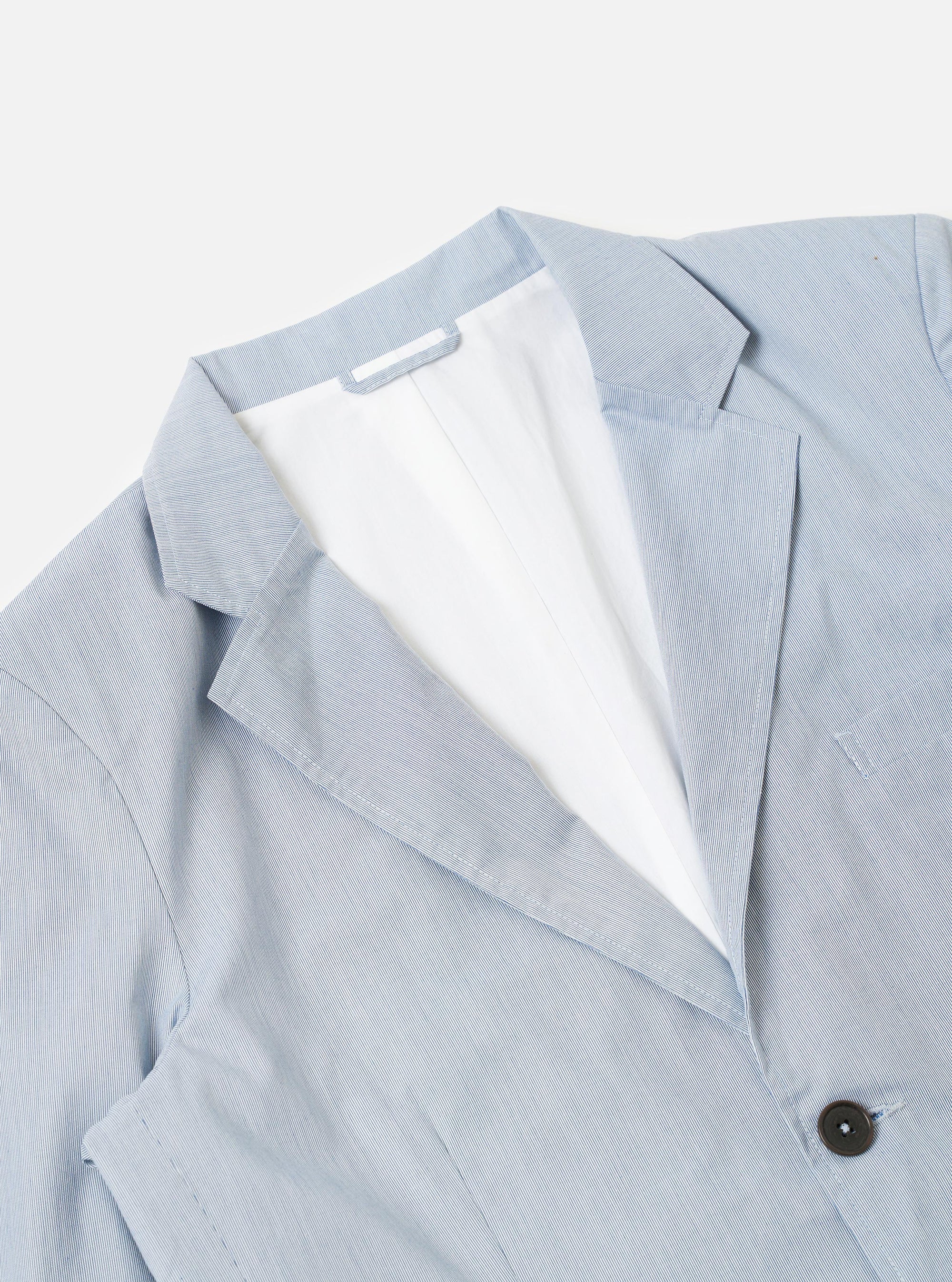 The Navy Kennedy Stripe Boston Blazer is shown from the back as a flat lay against a plain white background. The image highlights the horizontal navy and white stripes of the cotton fabric, a central vertical seam, and the clean lines of the shoulders and hem.